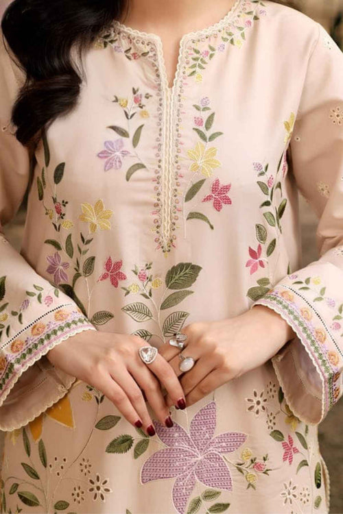 Beige embroidered kurta with floral patterns worn by a person.