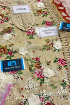 Floral fabric with embroidery details and Jaunaid Bora branding.