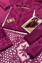 Purple fabric with intricate lace patterns and a small model wearing the fabric.