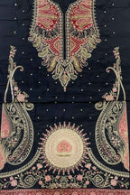 Black cotton fabric suit material featuring intricate gold, pink, and red embroidery with a large mandarin collar, paisley motifs, and a central circular floral design.