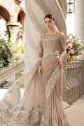 Woman in an elegant beige gown with floral decorations in a decorative setting