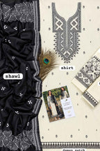 A flat-lay presentation of a traditional South Asian salwar suit set, featuring a cream-colored kurta with black geometric embroidery, a solid black shawl with white borders, and matching embroidered fabric pieces. A peacock feather and a small printed card are styled on top.