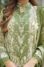 Green and white patterned garment with a person wearing it