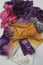 Colorful satin fabric with floral patterns on a white background