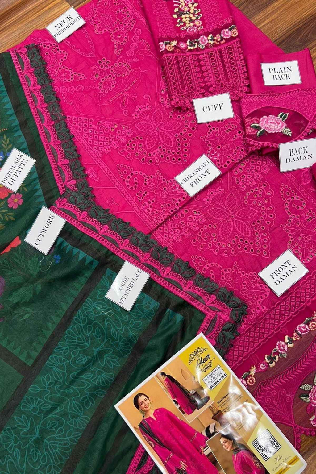 Display of pink and green fabric with labels and a product card.