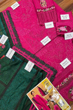 Display of pink and green fabric with labels and a product card.